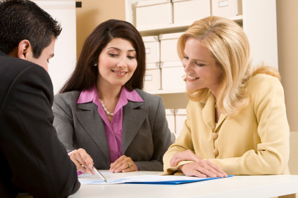 Image of a jeweller with customers